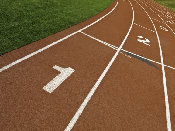 Staggered lane numbers on rubberized surface of all-weather running track.jpeg