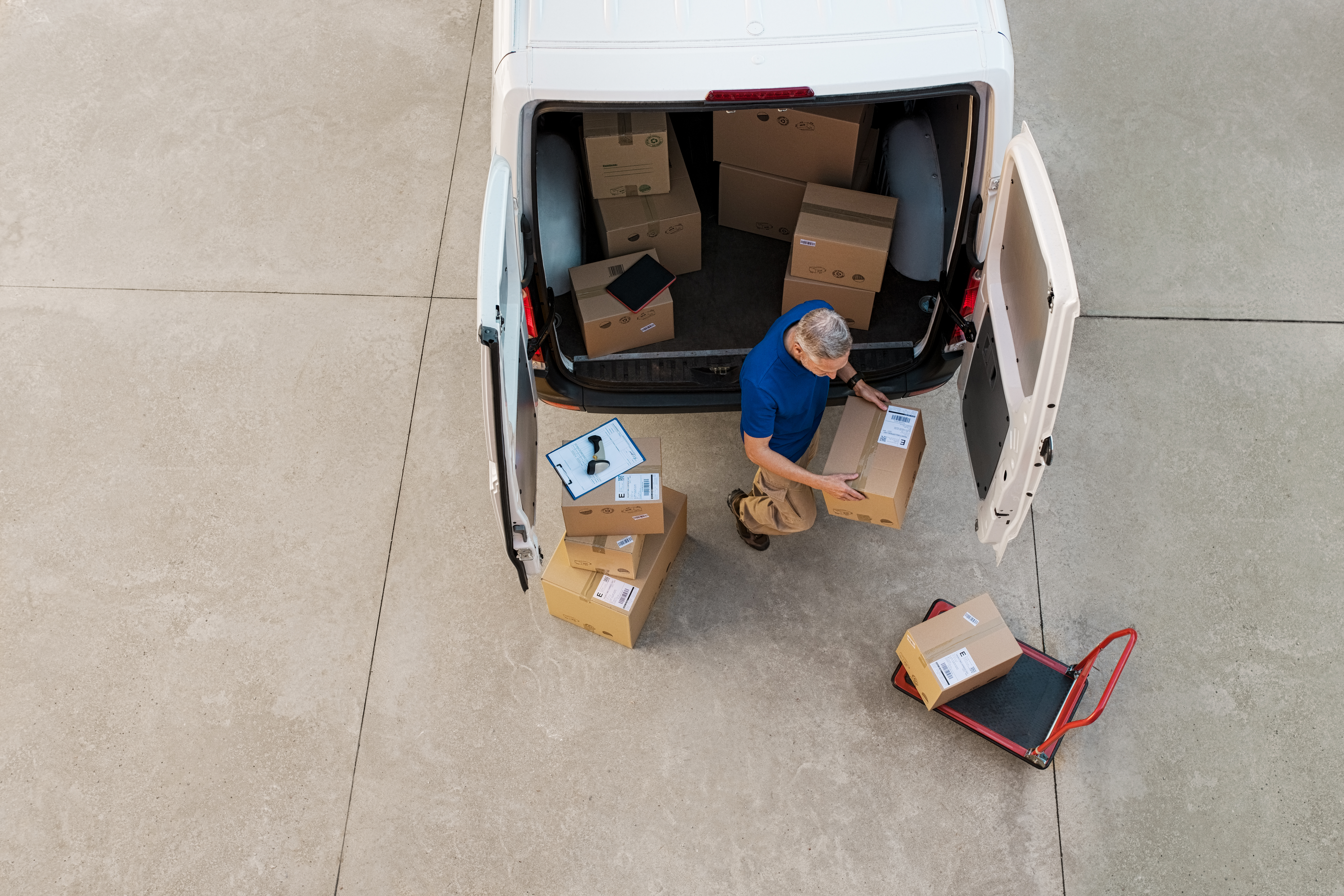 courier-delivering-parcel-PQZHBGE